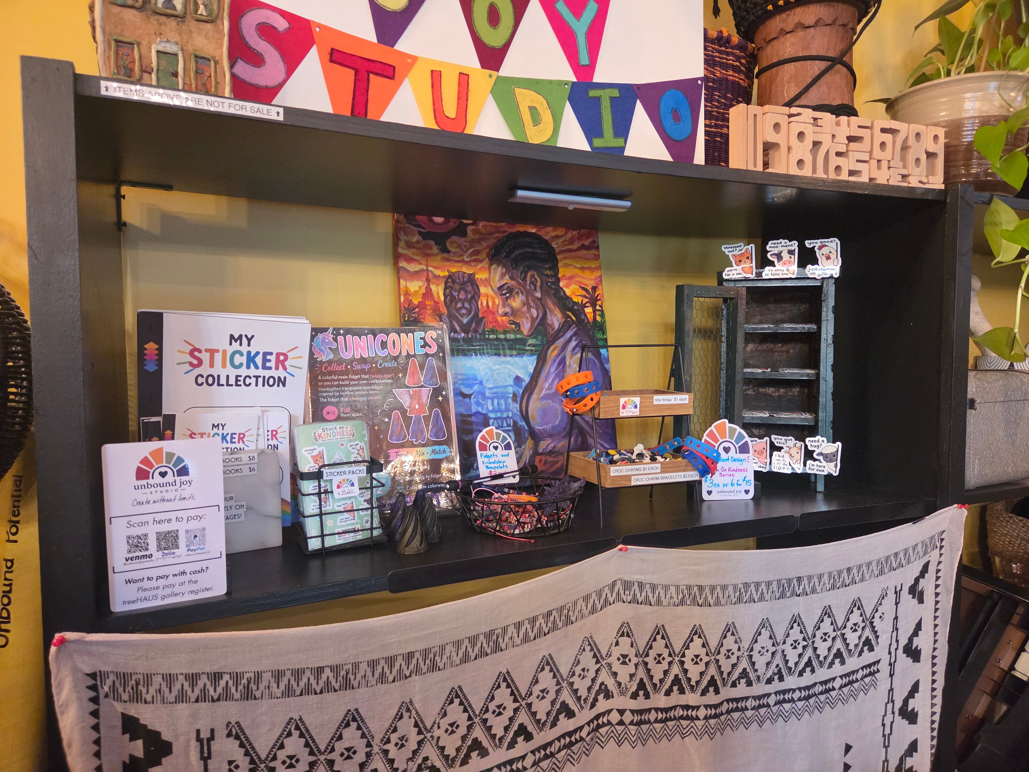 Sticker packs and collection books on the shop shelf